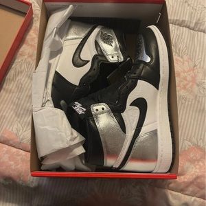 New in box woman’s size 9 silver toe Jordan’s